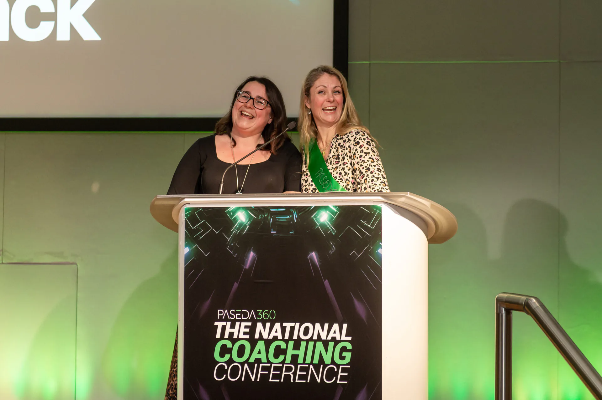Conversation between delegates at the 2026 National Coaching Conference
